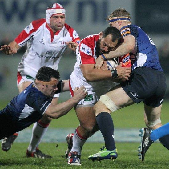 Leinster's Cian Healy and Jamie Heaslip combine to halt the progress of Ulster forward John Afoa