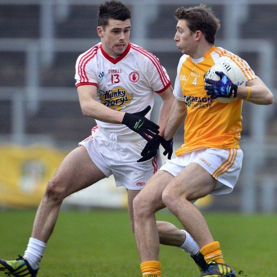 Darren McCurry of Tyrone in McKenna Cup action against Antrim's Sean Finch at Casement Park