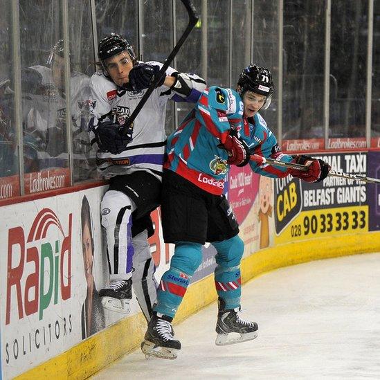 Craig Peacock of the Belfast Giants checks Davide Nicoletti of the Braehead Clan