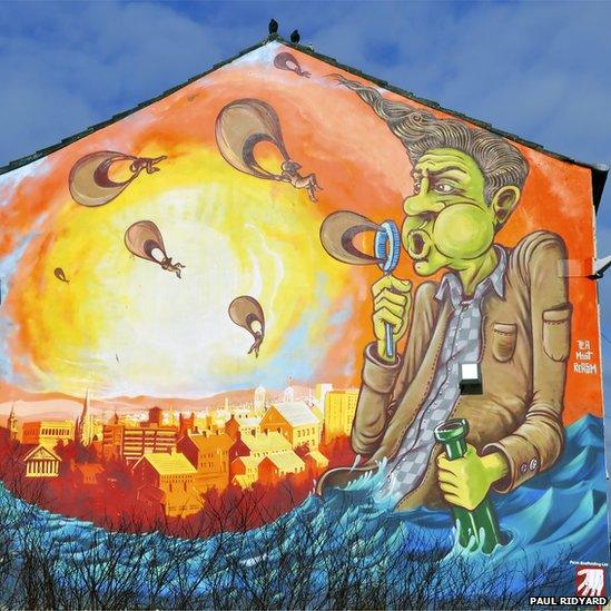 Mural of a bubble blowing character watching the sun set over the Preston cityscape. Picture: Paul Ridyard