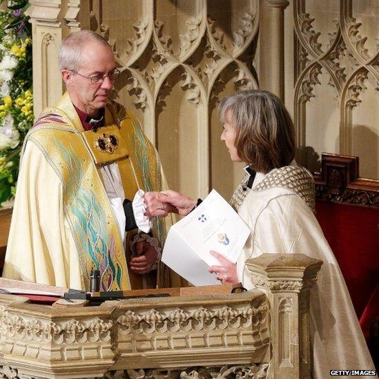 The archbishop being installed on the diocesan throne by the Venerable Sheila Watson