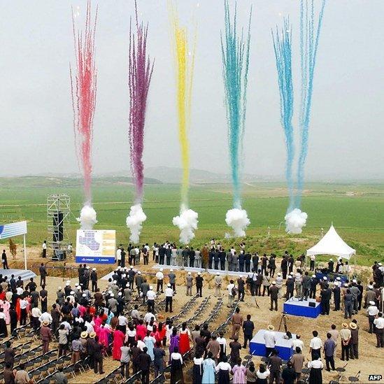 South and North Koreans take part in a ground-breaking ceremony in Kaesong,, 30 June 2003