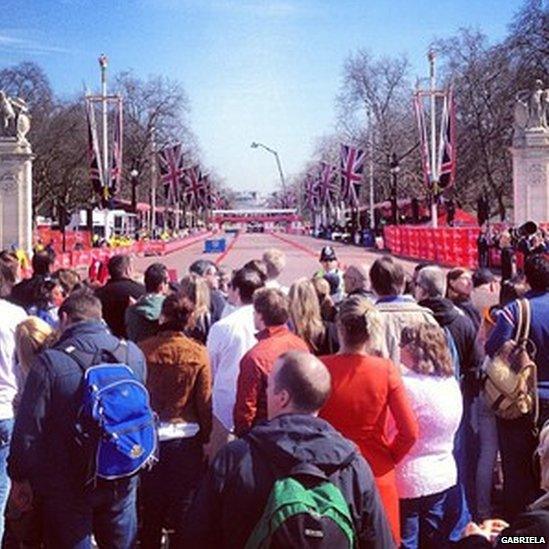 Spectators wait at the finishing line on The Mall. Photo: Gabriela