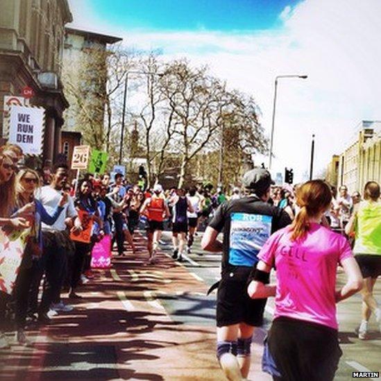 Runners at mile and supporters 21.