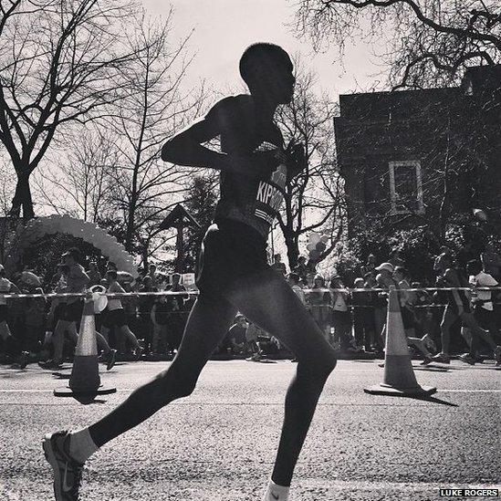 A runner runs by Tower Bridge. Photo: Luke Rogers