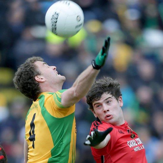 Eamonn McGee challenges Down opponent Niall Madine for a high ball in the Ulster semi-final which Donegal won 0-12 to 0-9