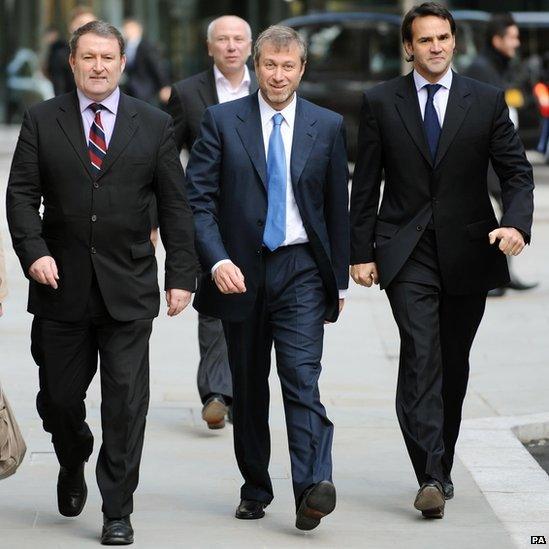 Chelsea FC owner Roman Abramovich (centre) outside the Royal Courts of Justice in central London where gave evidence in his battle with exiled Russian oligarch Boris Berezovsky