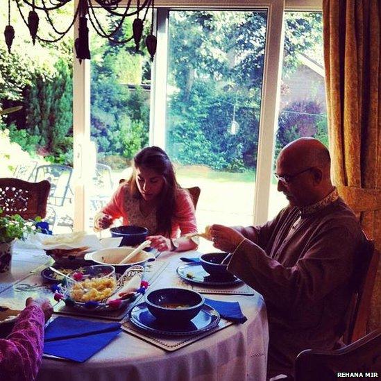 Rehana's daughter and husband eat traditional Eid breakfast. Photo: Rehana Mir