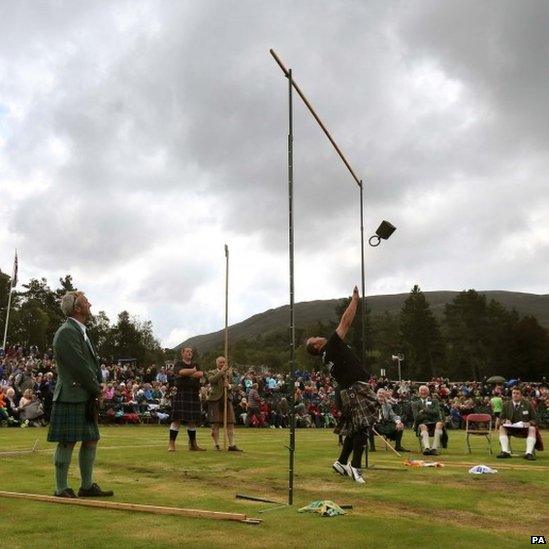 Throwing weight over bar at the Braemar Gathering