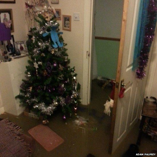 Christmas tree in flooded house.