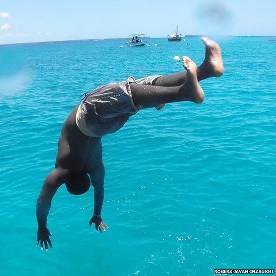 Man diving in ocean