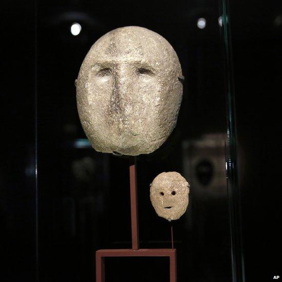 A 9,000 year-old mask is on display at the Israel Museum in Jerusalem on 10 March 2014.