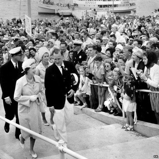 Queen Elizabeth II and Prince Philip, Duke of Edinburgh (left) are greeted by Premier of New South Wales Joseph Cahill (1891 - 1959) and his wife Esmey before a State Banquet in Sydney in 1954