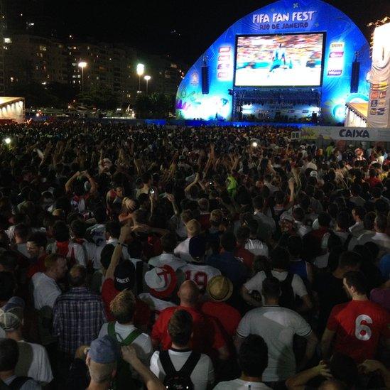 Fans watch England v Italy in the 2014 World Cup at a fans area on Copacabana beach