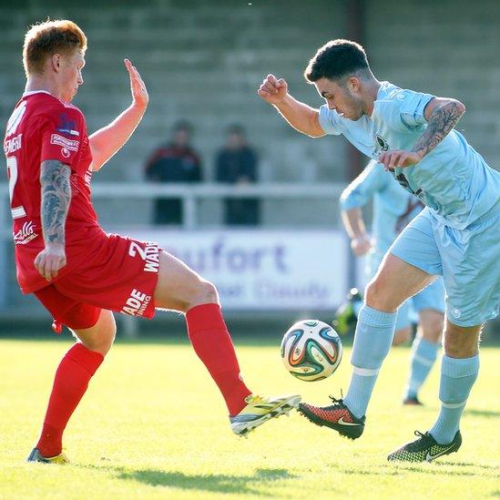 Portadown defender Chris Casement challenges Institute opponent Jordan Armstrong during the Irish Premiership clash at Drumahoe