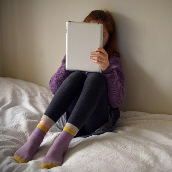Teenager with tablet