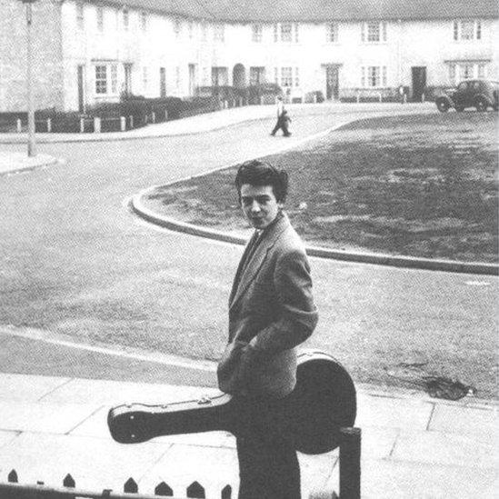 George Harrison outside his childhood home