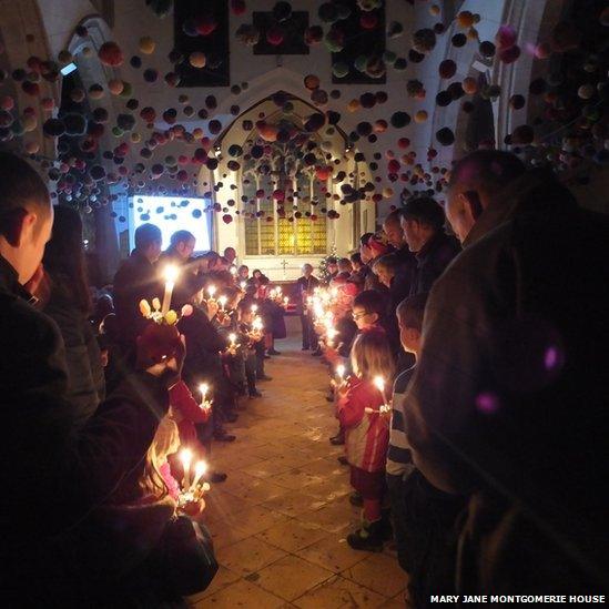 Candlelit service with pom poms