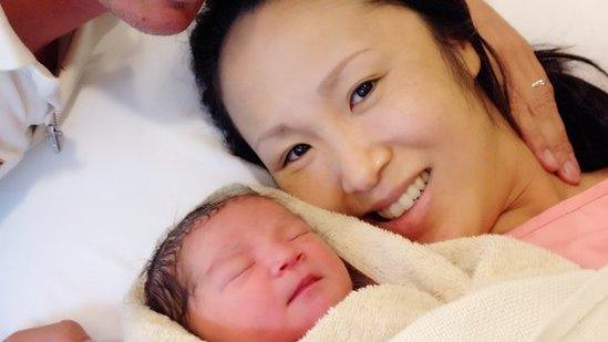 Mariko Oi with her husband Skye Neal and their baby daughter Miku Rose