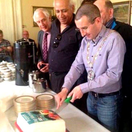 Andrew Muir cuts cake