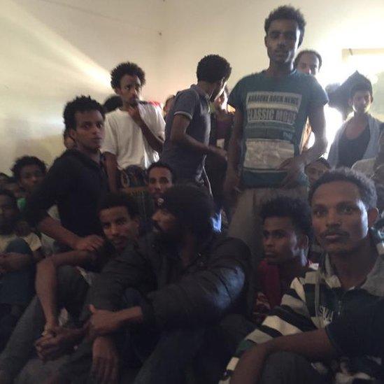 A group of men in the detention centre