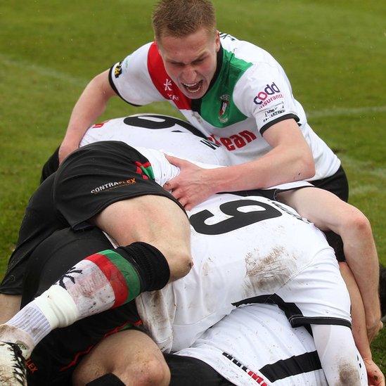 Glentoran players celebrate after David Scullion had scored the winner against Portadown in the 2015 Irish Cup final