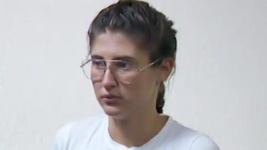 Bella Culley filmed in court. She is wearing glasses and has brown hair in a plait and is wearing a white top