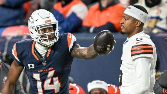 Courtland Sutton of the Denver Broncos signals first down in front of Jameis Winston of the Cleveland Browns