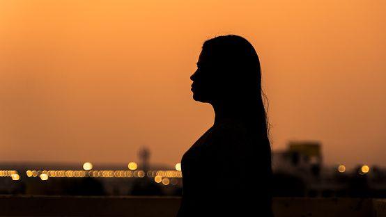 Representative image: Silhouette of a woman during sunset or sunrise