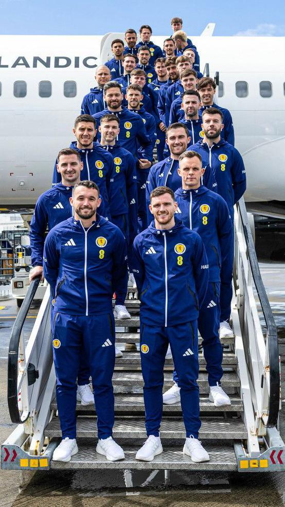 The Scotland squad pose for one last photo before departure