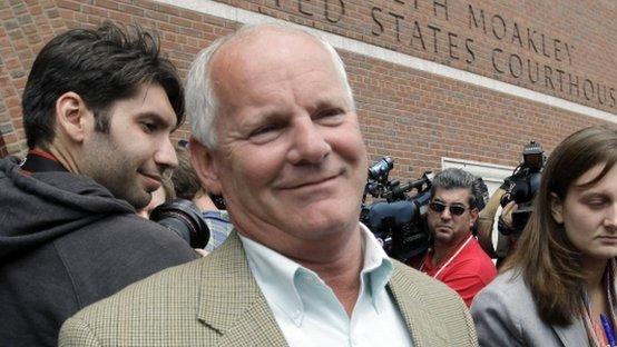 Stephen Rakes receives a handshake outside federal court in Boston 12 June 2012