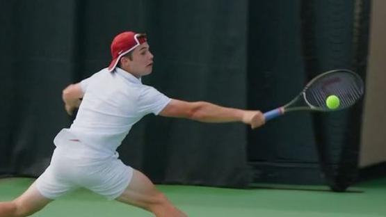 Arthur Fery stretches for a backhand while playing for Stanford University