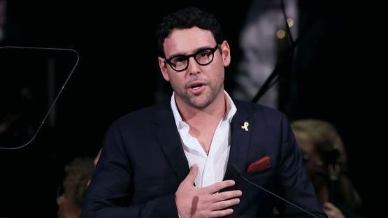 Scooter Braun speaking at the Anti Defamation League's In Concert Against Hate at the Kennedy Center in the US last year. He is wearing black glasses, a white shirt and a navy suit.