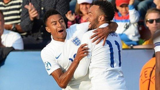 Jesse Lingard (left) celebrates scoring for England