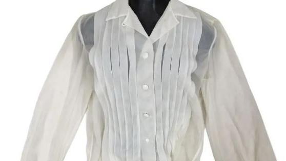 A white long-sleeved ladies' blouse with white buttons