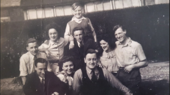 Mr Gwilt is pictured as a child in a black and white photo with eight family members in the garden of the Stafford Road house.