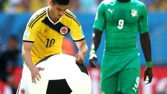 James Rodriguez tackles an inflatable