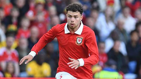 Neco Williams in action for Wales