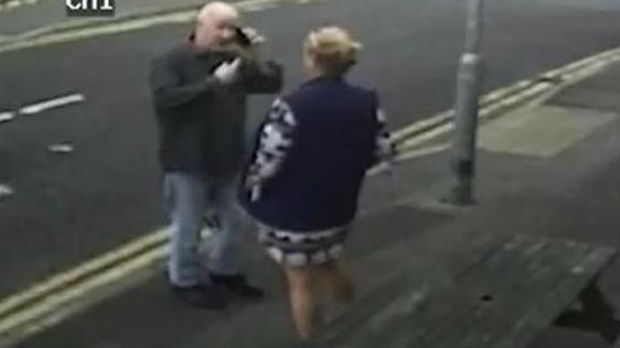 Stephanie Langley and Matthew Bryant on a pavement facing each other