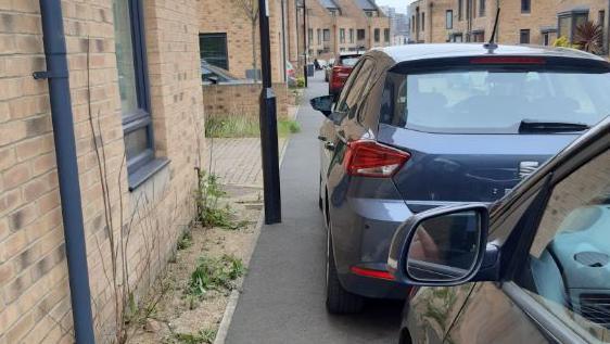 Cars blocking a pavement