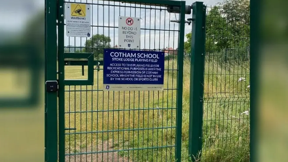 The fenced off entrance to the field 