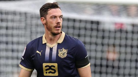Ben Heneghan in action for Port Vale