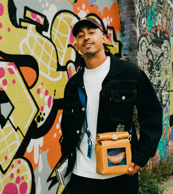 Jordan Stephens from Rizzle Kicks wearing Lidl bag