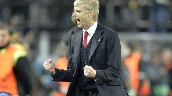 Arsenal manager Arsene Wenger celebrates at the final whistle of his side's win over Borussia Dortmund