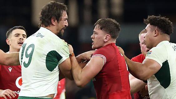 South Africa lock Eben Etzebeth and Wales flanker Alex Mann grapple