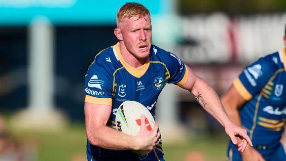 Zac Cini of the Eels runs the ball during the NRL Trial Match between the Penrith Panthers and the Parramatta Eels at BlueBet Stadium on February 11, 2023 in Penrith, Australia.