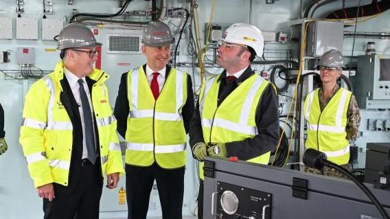 Prime Minister Sir Keir Starmer and Defence Secretary John Healey listen to Type 26 Programme Director, BAE Systems David Shepherd during a visit to BAE Systems in Govan, Glasgow