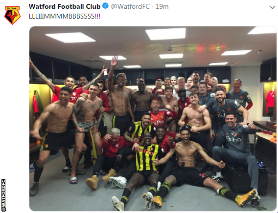 Watford players celebrate in the dressing room at full-time