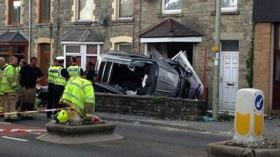 car crashes into house