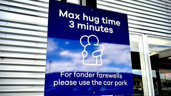 Three minute hugging sign.